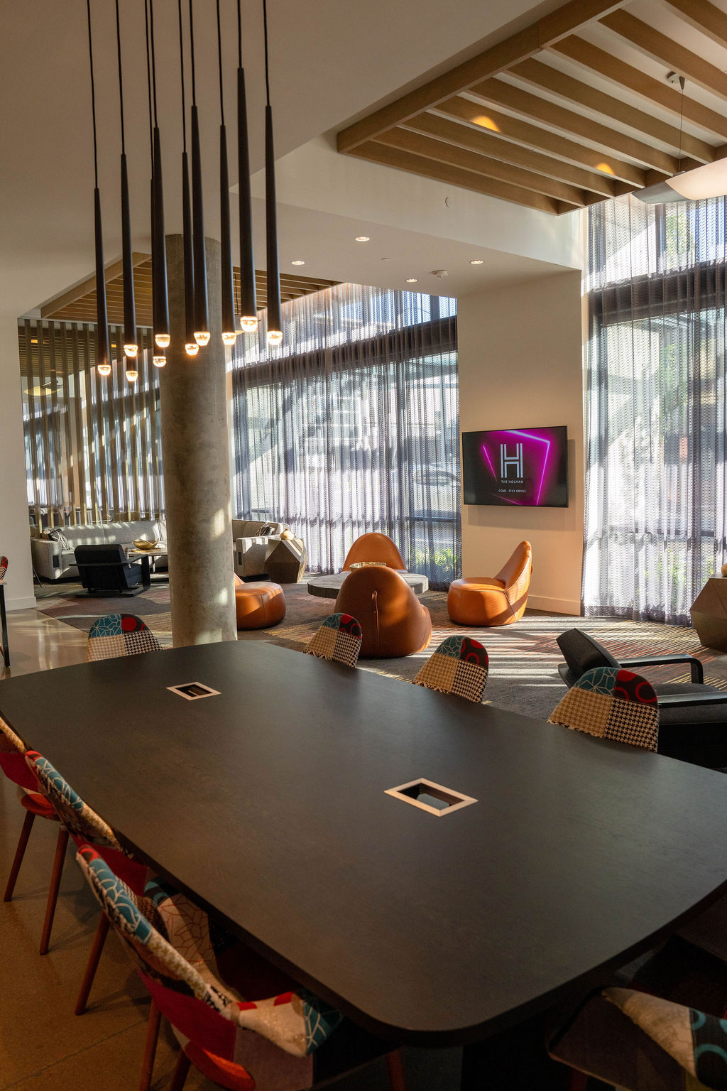 Lobby with boardroom table in foreground and sign in backgroun web res
